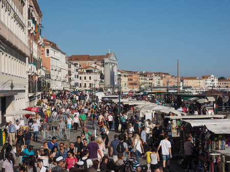 VENICE, ITALY - CIRCA SEPTEMBER 2016: Tourists in Riva degli Schiavoni waterfront promenade at St Mark Basinのeditorial素材