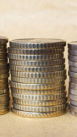 Pile of Euro coins currency of the European Union - selective focus on coins with blurred background copy space - verticalの写真素材