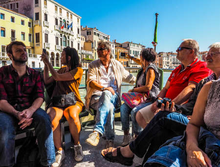 VENICE, ITALY - CIRCA SEPTEMBER 2016: HDR Travellers on a vaporetto (meaning waterbus) public transportのeditorial素材