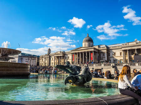 LONDON, UK - SEPTEMBER 27, 2015: Tourists in Trafalgar Square (HDR)のeditorial素材