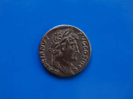 vintage Roman coins over a blue backgroundの写真素材