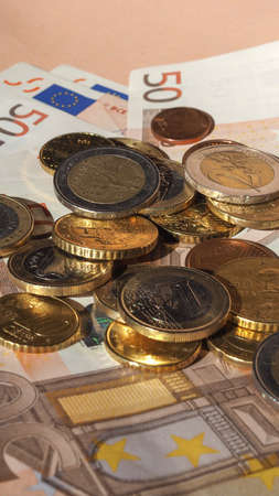 Euro coins and banknotes currency of the European Union - vertical