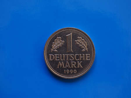 1 mark coin money (DEM), currency of Germany over blue backgroundの写真素材