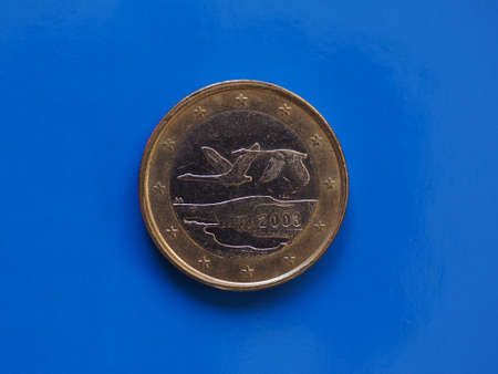 1 euro coin money (EUR), currency of European Union, Finland over blue backgroundの写真素材