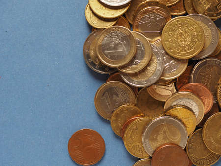 Euro coins money (EUR), currency of European Union over blue background with copy spaceの写真素材