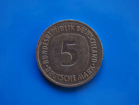 5 marks coin money (DEM), currency of Germany over blue backgroundの写真素材