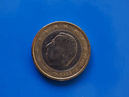 1 euro coin money (EUR), currency of European Union, Belgium over blue backgroundの写真素材
