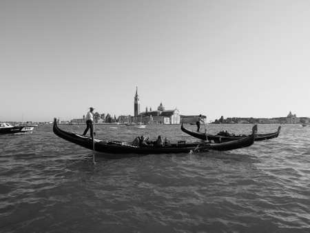 VENICE, ITALY - CIRCA SEPTEMBER 2016: Gondola traditional flat bottomed rowing boat in the Venetian lagoon in black and whiteのeditorial素材