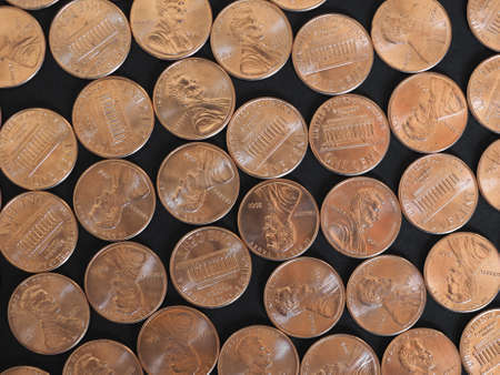 One Cent Dollar coins money (USD), currency of United States over black backgroundの写真素材
