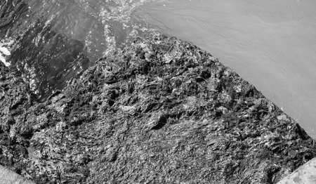 Algae on a sea port harbour quay in black and whiteの写真素材