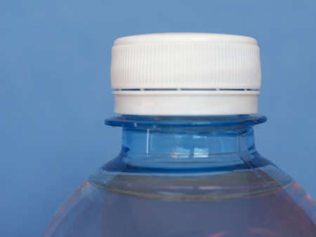 bottle of water over a blue background with copy spaceの写真素材