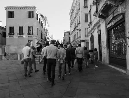 VENICE, ITALY - CIRCA SEPTEMBER 2016: Tourists visiting the city of Venice in black and whiteのeditorial素材