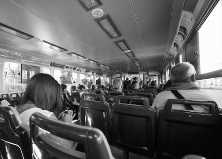 VENICE, ITALY - CIRCA SEPTEMBER 2016: Travellers on a vaporetto (meaning waterbus) public transport in black and whiteのeditorial素材