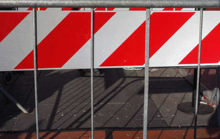 red and white striped temporary fence line