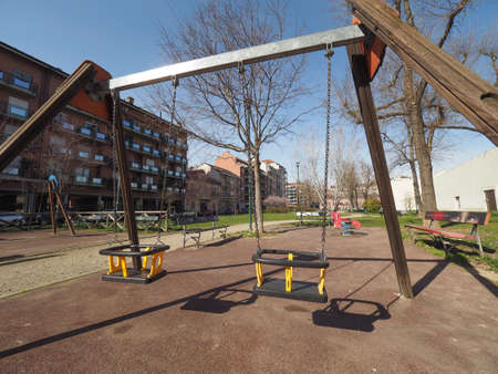 TURIN, ITALY - CIRCA MARCH 2017: swing in outdoor public playground for childrenのeditorial素材