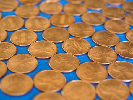 One Cent Dollar coins money (USD), currency of United States over blue background