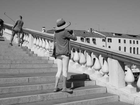 VENICE, ITALY - CIRCA SEPTEMBER 2016: Tourists visiting the city of Venice in black and whiteのeditorial素材