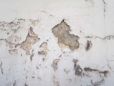 Damage caused by damp and moisture on a wall
