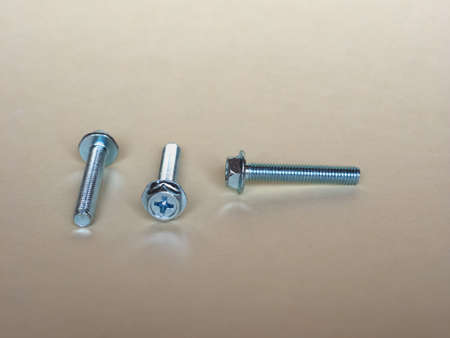 Steel bolts fasteners industrial hardware on a table
