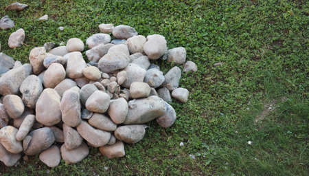 heap of stones on a meadow in a building siteの写真素材