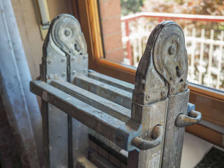 folding aluminium ladder in a construction siteの写真素材