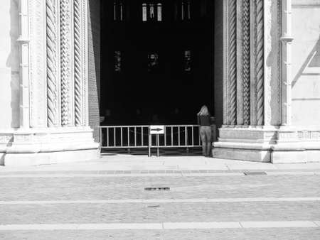 COMO, ITALY - CIRCA APRIL 2017: Santa Maria Assunta Roman Catholic cathedral church entrance in black and whiteのeditorial素材