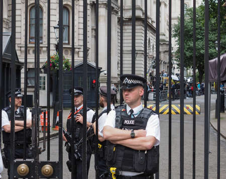 LONDON, UK - JUNE 09, 2017: Police and press waiting for Theresa May in front of 10 Downing Street on the day following the general electionsのeditorial素材