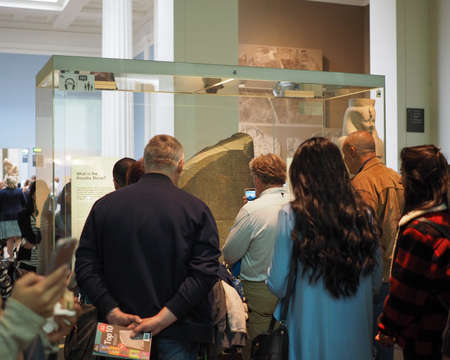 LONDON, UK - CIRCA JUNE 2017: Tourists visiting the Rosetta Stone at British Museumのeditorial素材