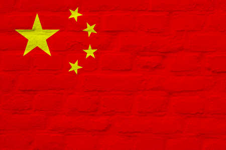The national flag of China painted over brick wall backgroundの写真素材