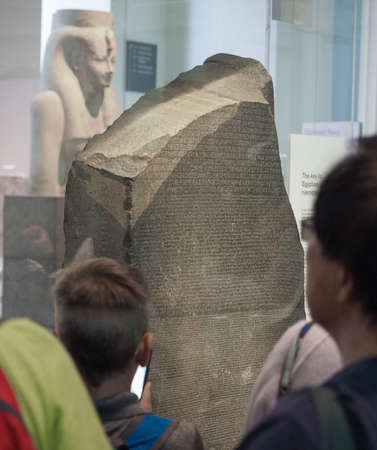 LONDON, UK - CIRCA JUNE 2017: Tourists visiting the Rosetta Stone at British Museumのeditorial素材