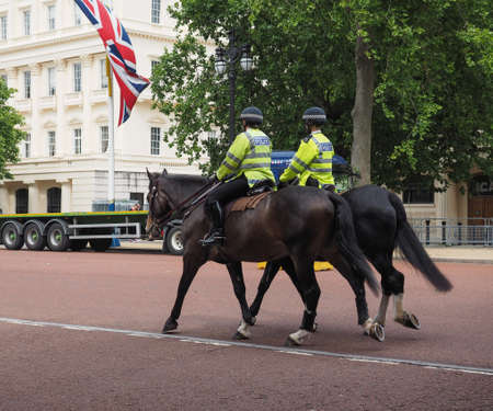 LONDON, UK - CIRCA JUNE 2017: Mounted metropolitan police officers patrol on horseback on the Strand