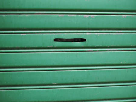 green metal texture of rolling shutter useful as a backgroundの写真素材