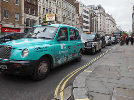 LONDON, UK - CIRCA JUNE 2017: Taxi cabs in the city centre