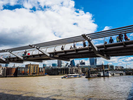 LONDON, UK - CIRCA JUNE 2017: Millennium Bridge over River Thames linking the City of London with the South Bank between St Paul Cathedral and Tate Modern art gallery (high dynamic range)のeditorial素材