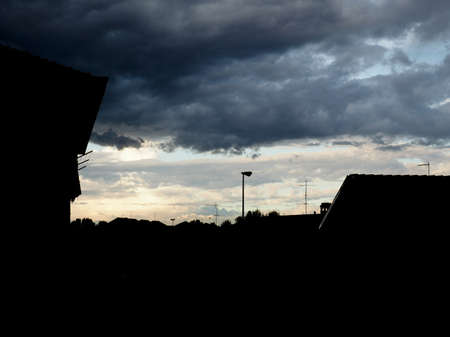 stormy dark blue sky with clouds useful as a backgroundの写真素材