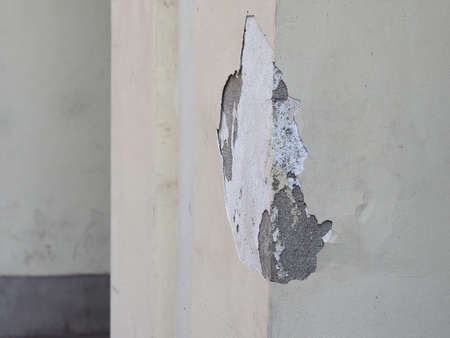Damage caused by damp and moisture on a wall