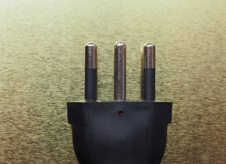 Italian electrical plug, similar to European plug but with one more central pin for earth groundingの写真素材