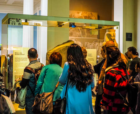 LONDON, UK - CIRCA JUNE 2017: Tourists visiting the Rosetta Stone at British Museum (high dynamic range)のeditorial素材