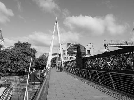 LONDON, UK - CIRCA JUNE 2017: Jubilee Bridge over River Thames links Charing Cross to the South Bank  in black and whiteのeditorial素材