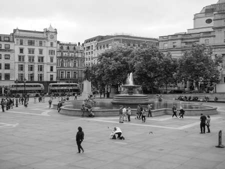 LONDON, UK - CIRCA JUNE 2017: People in Trafalgar Square in black and white