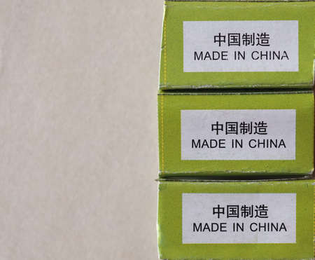 Made in China label written on a packet in English and in Simplified Chinese with copy spaceの写真素材