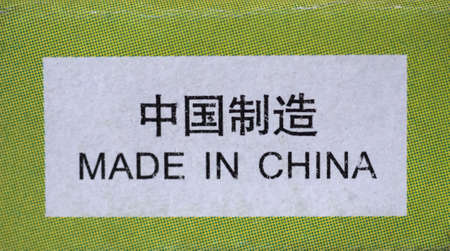 Made in China label written on a packet in English and in Simplified Chineseの写真素材