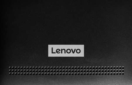 BEIJING, CHINA - CIRCA DECEMBER 2017: Lenovo logo on a mobile phone. Lenovo is a major player in laptop and desktop computer sales worldwide and mobiles expecially in the Asian market.のeditorial素材