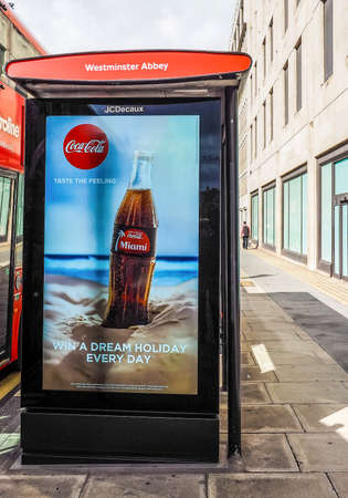 LONDON, UK - CIRCA JUNE 2017: Westminster Abbey bus stop with Coca Cola ad (high dynamic range)のeditorial素材