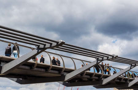LONDON, UK - CIRCA JUNE 2017: Millennium Bridge over River Thames linking the City of London with the South Bank between St Paul Cathedral and Tate Modern art gallery (high dynamic range)のeditorial素材