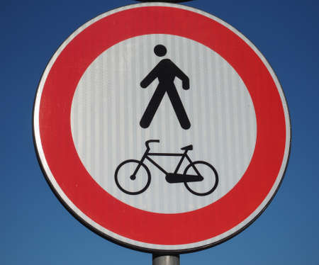 no pedestrians and bikes traffic sign over blue skyの写真素材