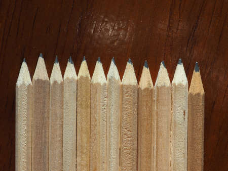 many wooden pencils on a desk top