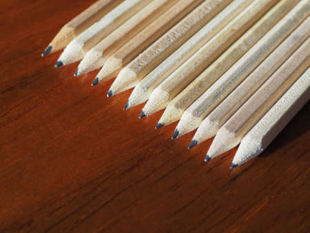 Many wooden pencils on a desk top with copy spaceの写真素材
