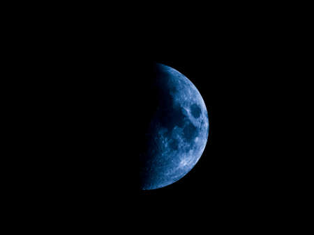 High contrast First quarter moon seen with an astronomical telescope (seen through my own telescope, no NASA images used)の写真素材