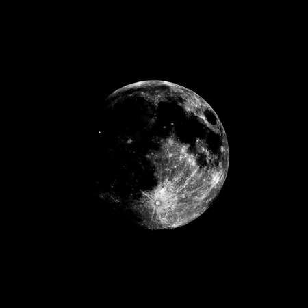 High contrast Full moon seen with an astronomical telescope, highly contrasty dramatic tones